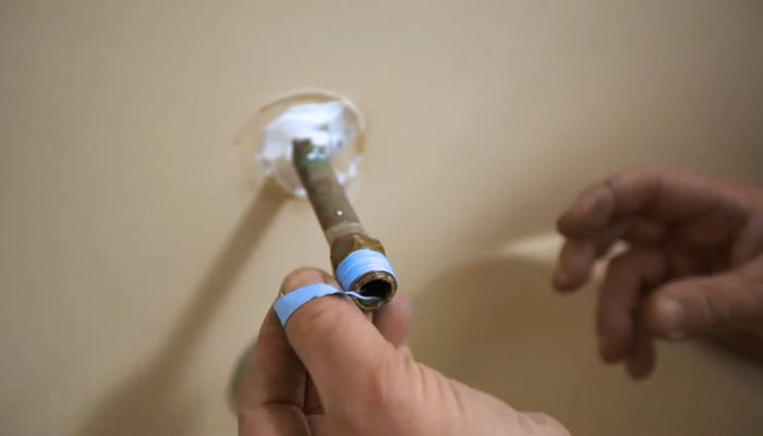 Wrap-Plumbing-Tape-Around-the-Pipes-Thread-Area